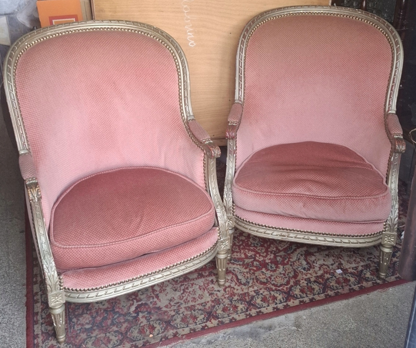 A pair of French 'Bergère en Gondole' Armchairs